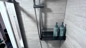 Shower, hair dryer, towels