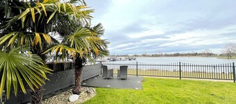 Waterfront holiday home with a large garden