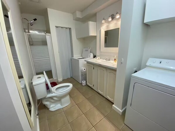Shower, hair dryer, towels, soap
