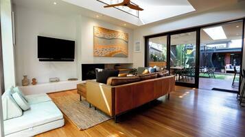 TV, fireplace, books, offices