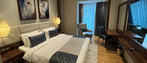 Standard Double or Twin Room | In-room safe, desk, laptop workspace, blackout drapes