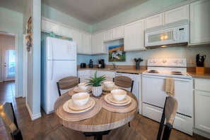 Enjoy cooking in this well-equipped kitchen with a microwave, stove, and coffee maker.