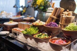 Enjoy a diverse selection of salads and vegetables at our buffet.
