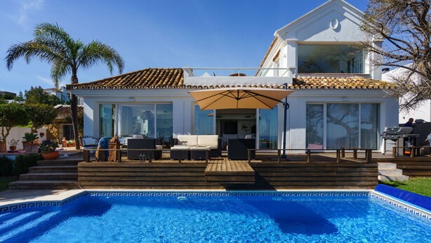 A two-story house with a swimming pool, outdoor seating, and a patio area. - Villa Sara by Interhome (Manilva)