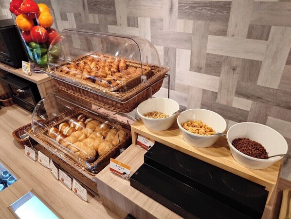 A breakfast buffet with various bread and cereal options. - Hotel Route Inn Grand Fukushima Ekimae (Fukushima)