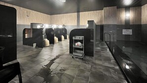 A modern restroom with multiple sinks, a trash bin, and a hand dryer. - Hotel Route Inn Grand Fukushima Ekimae (Fukushima)