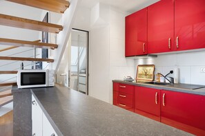 Fridge, microwave, stovetop, coffee/tea maker