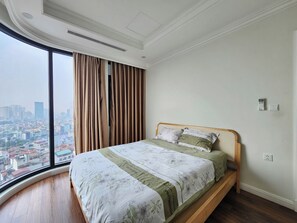 Desk, laptop workspace, blackout curtains, soundproofing - Hateco Laroma Royal Apartments (Hanoi)