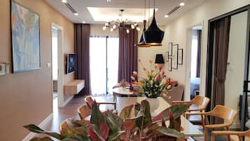 Deluxe Apartment, 3 Bedrooms, Balcony, City View | Living area | Smart TV