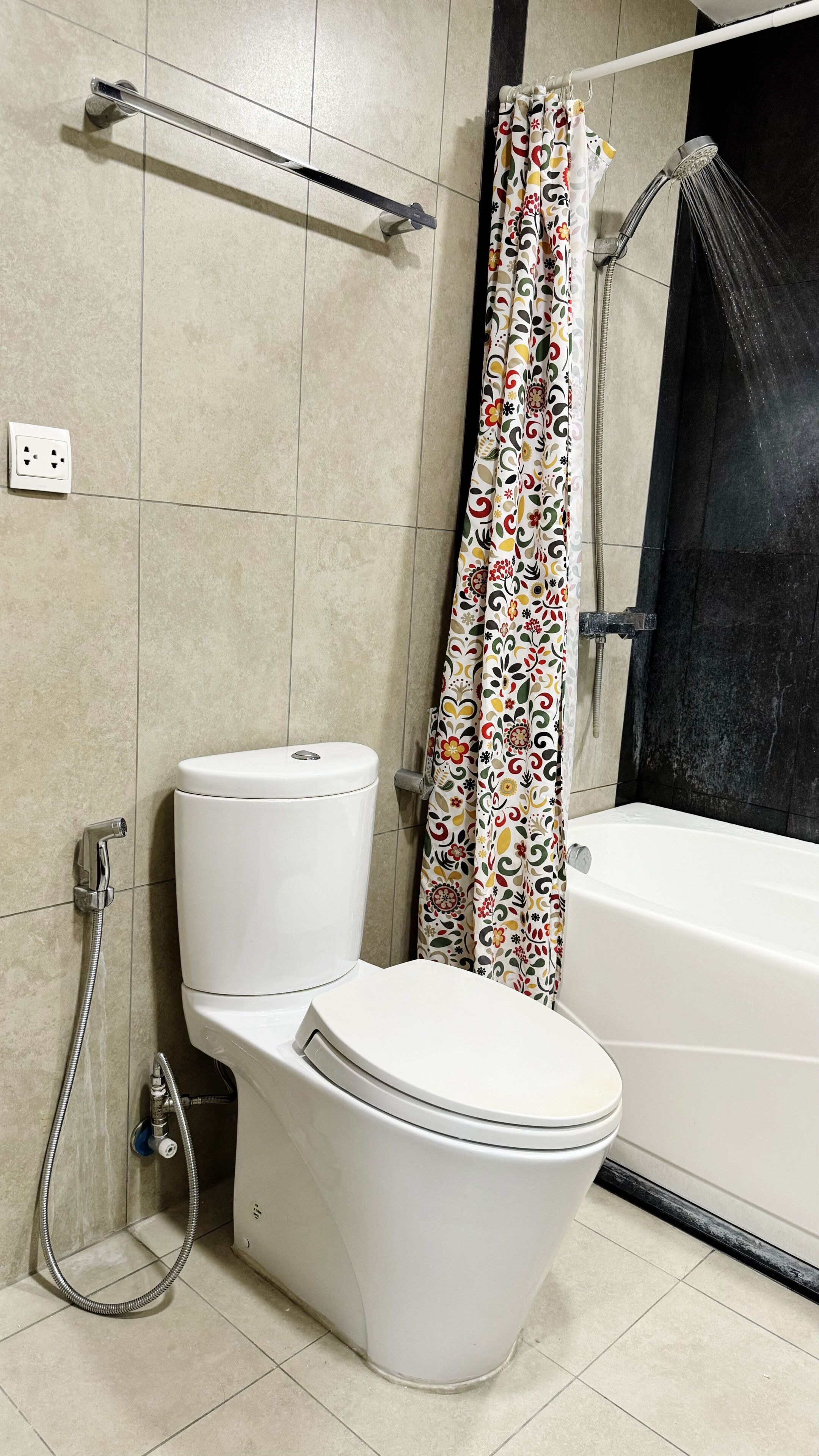 A bathroom with a toilet, a shower, and a bathtub.
