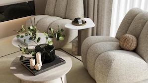 A modern living room with two sofas, a coffee table, and a side table.