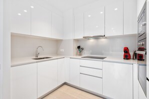 Fridge, microwave, oven, stovetop - Modern Diagonal Mar Oasis: 2BR Apartment with Pools & Parking (Barcelona)