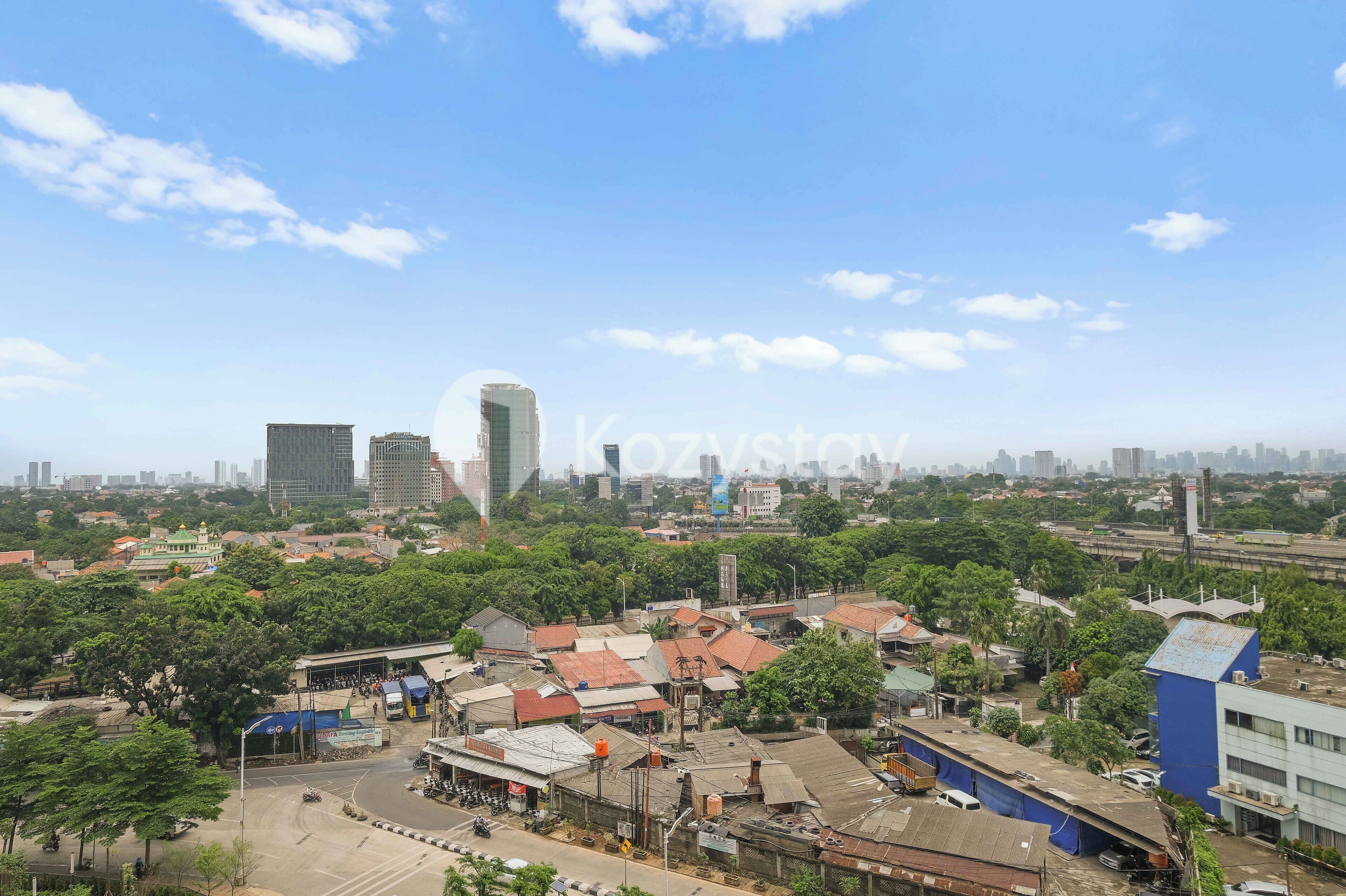 A cityscape with a mix of modern high-rise buildings and traditional low-rise structures.