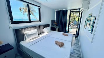 Kamar Double Deluks, pemandangan laut terbatas, menghadap pantai | Kedap suara, Wi-Fi gratis, dan seprai linen