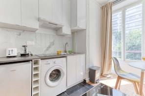 Fridge, microwave, stovetop, coffee/tea maker