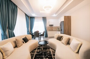 Suite Premium, vue montagne | Coin séjour