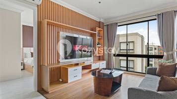 Apartment, 3 Bedrooms, Balcony, City View | Living area | Flat-screen TV