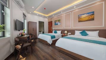Chambre Quadruple Deluxe, vue ville | Literie hypoallergénique, minibar, coffres-forts dans les chambres