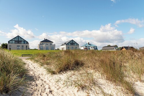 Ferienwohnung Gartenlounge - moderne Wohnung in Toplage direkt am Strand