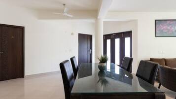 Deluxe Apartment | Living area | 42-inch LED TV with cable channels