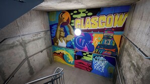 A stairwell with a colorful mural on the wall, including the word "GLASGOW". - Student Only Clyde Court (Glasgow)