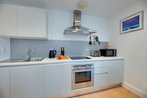 Appartement Confort | Cuisine privée | Chaise haute