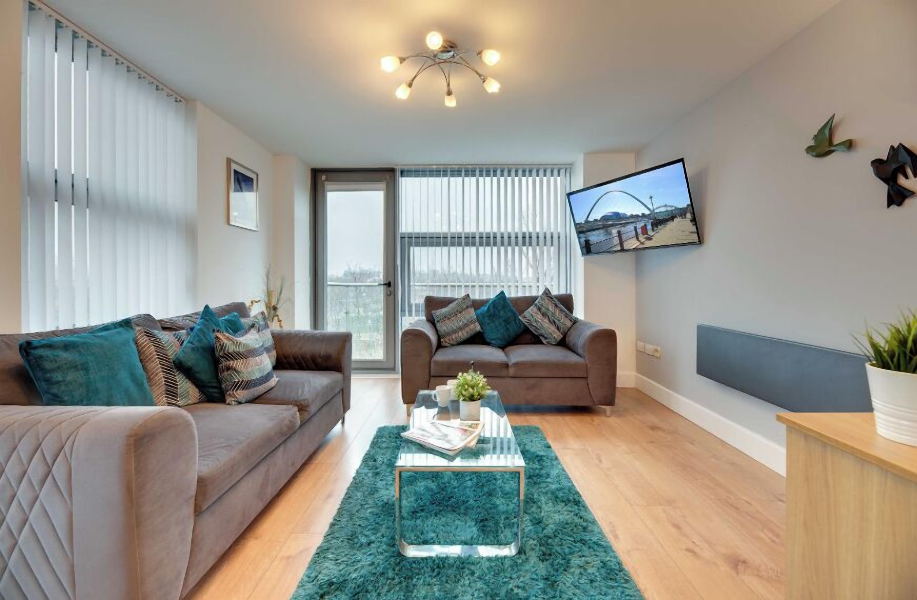 Comfort Apartment | Living area | 50-inch LCD TV with digital channels