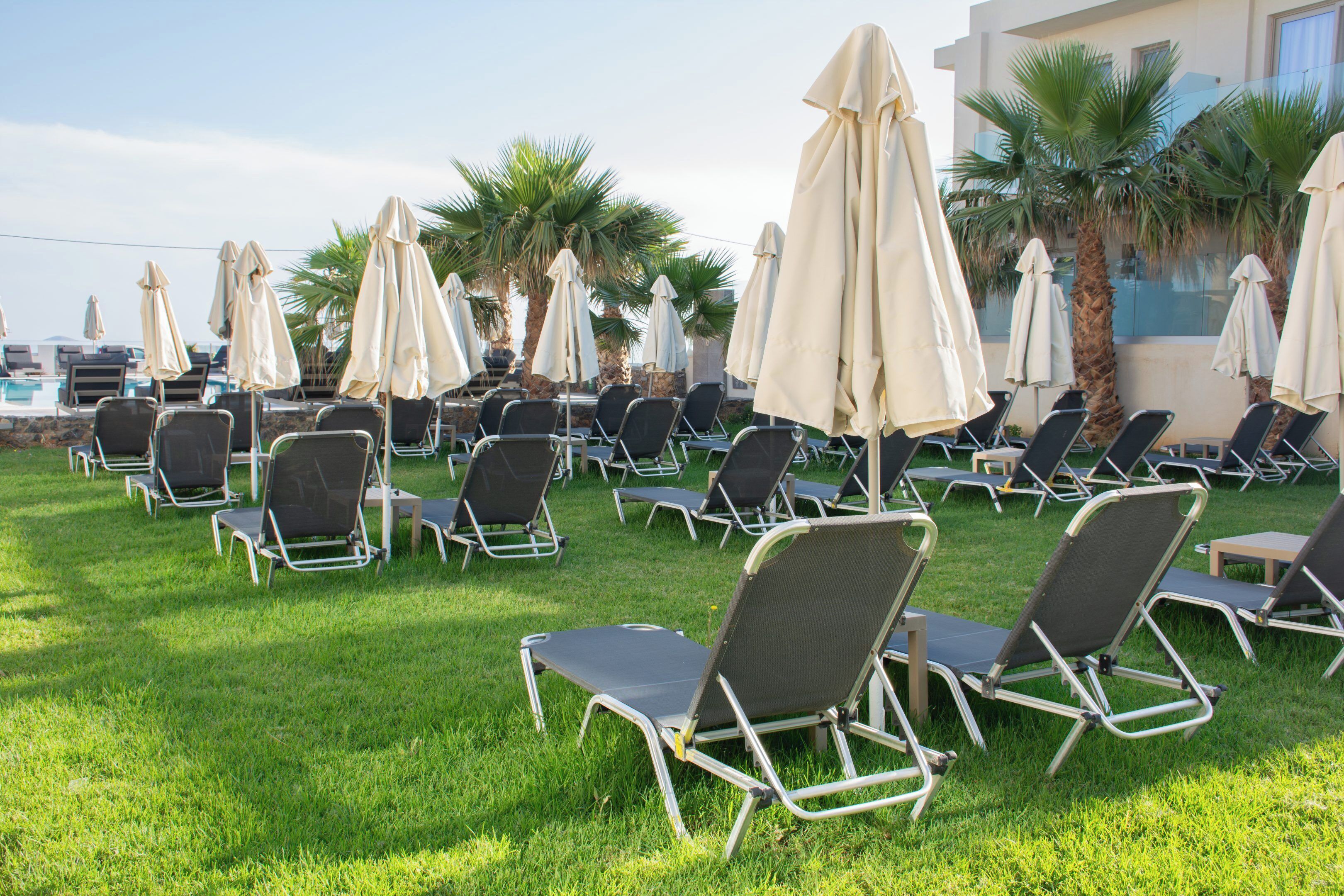Seasonal outdoor pool, open 9:00 AM to 7:00 PM, pool umbrellas