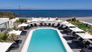Seasonal outdoor pool, open 9:00 AM to 7:00 PM, pool umbrellas