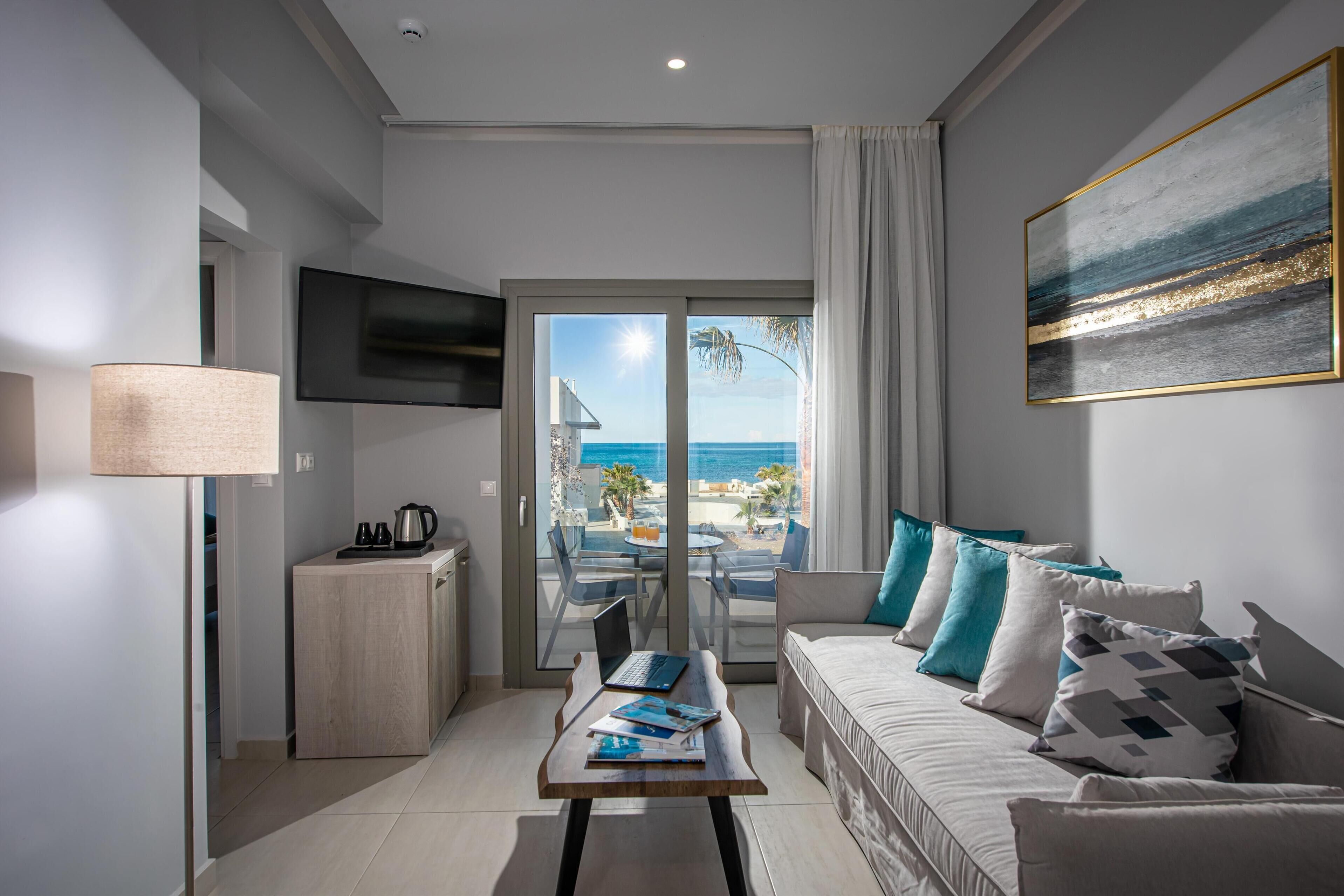 Junior Suite, 1 Bedroom, Sea View | In-room safe, laptop workspace, blackout drapes, soundproofing