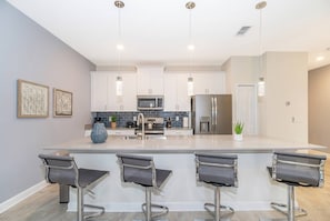 Fridge, microwave, oven, stovetop - Luxurious 4BR Home Pool Near Disney Storey Lake (Kissimmee)