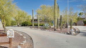 A paved pathway leading to a building with a 'Welcome to the Little House' sign, surrounded by cacti and desert plants. - Private Oro Valley Home w/ 130 Mi Bike Path Nearby (Oro Valley)
