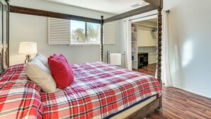 A four-poster bed with a plaid bedspread, a wooden ceiling, and a view of a closet and bathroom through an open door. - Private Oro Valley Home w/ 130 Mi Bike Path Nearby (Oro Valley)