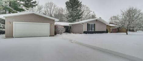 A residential area with a garage and a house.