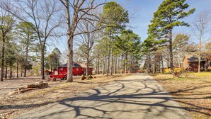 A rural road lined with trees and a red building. - 1 Mi to Dtwn Mountain View: Home w/ Deck (Mountain View)