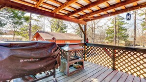 A covered deck with a grill and a lantern. - 1 Mi to Dtwn Mountain View: Home w/ Deck (Mountain View)