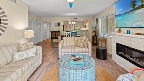 A living room with a sofa, coffee table, and a fireplace. - W Hyde Pk 19A in Kingston 1st floor, Pool, Beach (Myrtle Beach)
