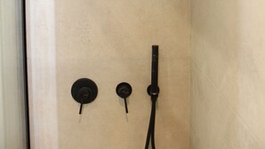 A shower with a handheld showerhead and two wall-mounted controls. - Pirgos Warm Studio for 3 by MPS (Pirgos)