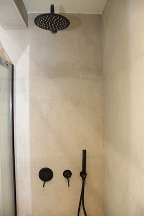 Shower, towels, soap, toilet paper