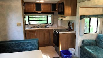 Fridge, microwave, stovetop, cookware/dishes/utensils