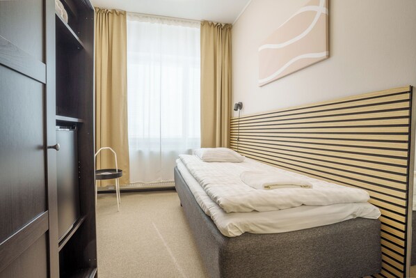 Habitación individual Deluxe | Caja de seguridad en la habitación, insonorización y wifi gratis 