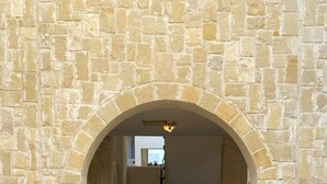 A stone archway leading to a staircase. - 43 MND - Stay Meadow Vista Apartment (Mandria)