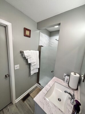 Shower, towels, soap, toilet paper