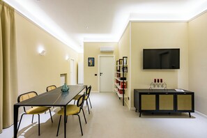 Enjoy meals together at the dining table, which seats four, or relax in comfort with a good book from the bookshelf.