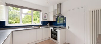 Lawhead Road is a beautifully renovated, pet-friendly home in St. Andrews, offering a peaceful retre