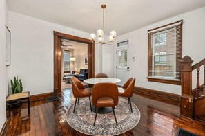Enjoy meals in this inviting dining area with a round table and comfortable seating for four.