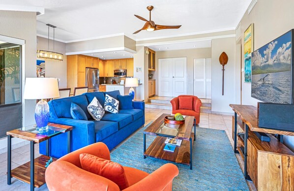 Colorful coastal living room with modern finishes and tropical flair.   