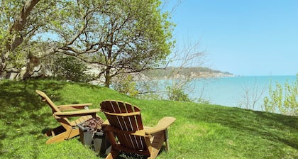 Heritage style cottage with lake view, perfect porch for family gatherings.