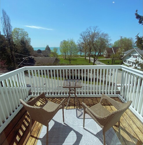 Heritage style cottage with lake view, perfect porch for family gatherings.