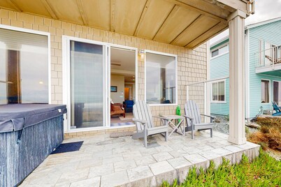 Modern oceanfront home with private hot tub, patio, & gas fireplace
